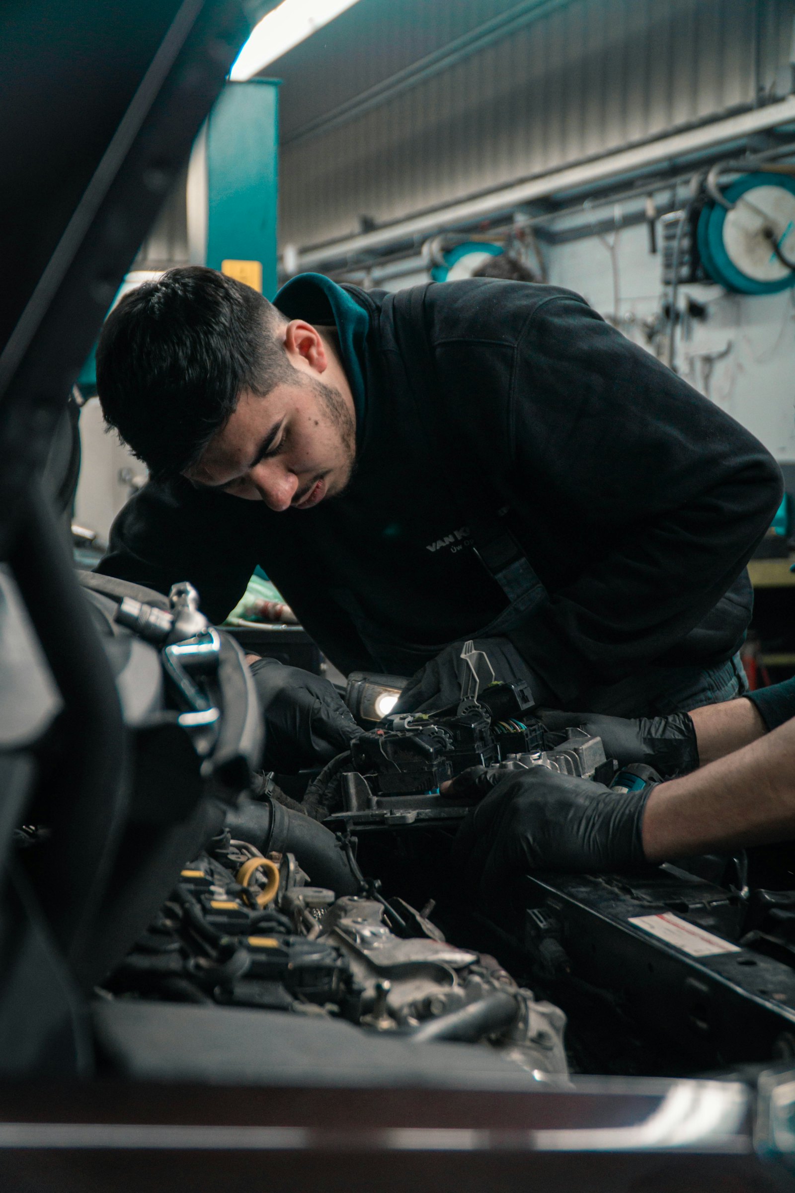 Mechanic working on a car engine